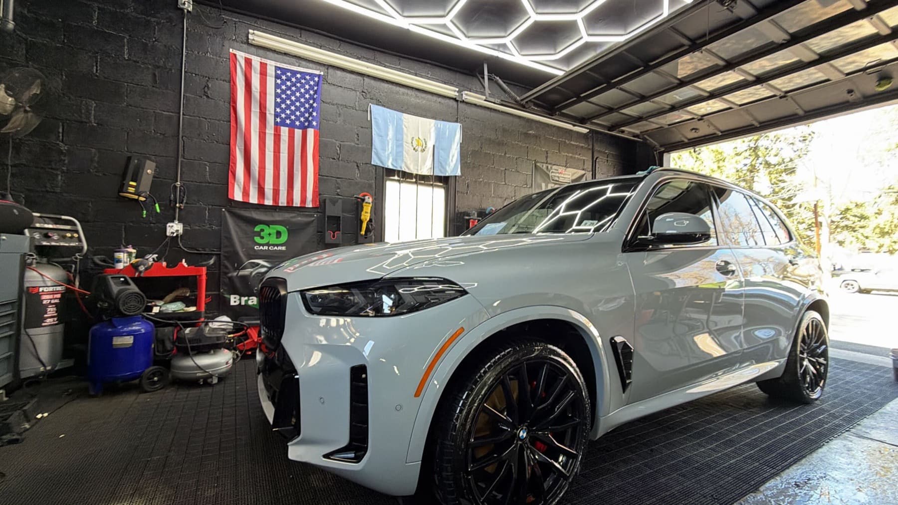 BMW X5 detailed inside the Insane Auto Detailing shop in Piscataway