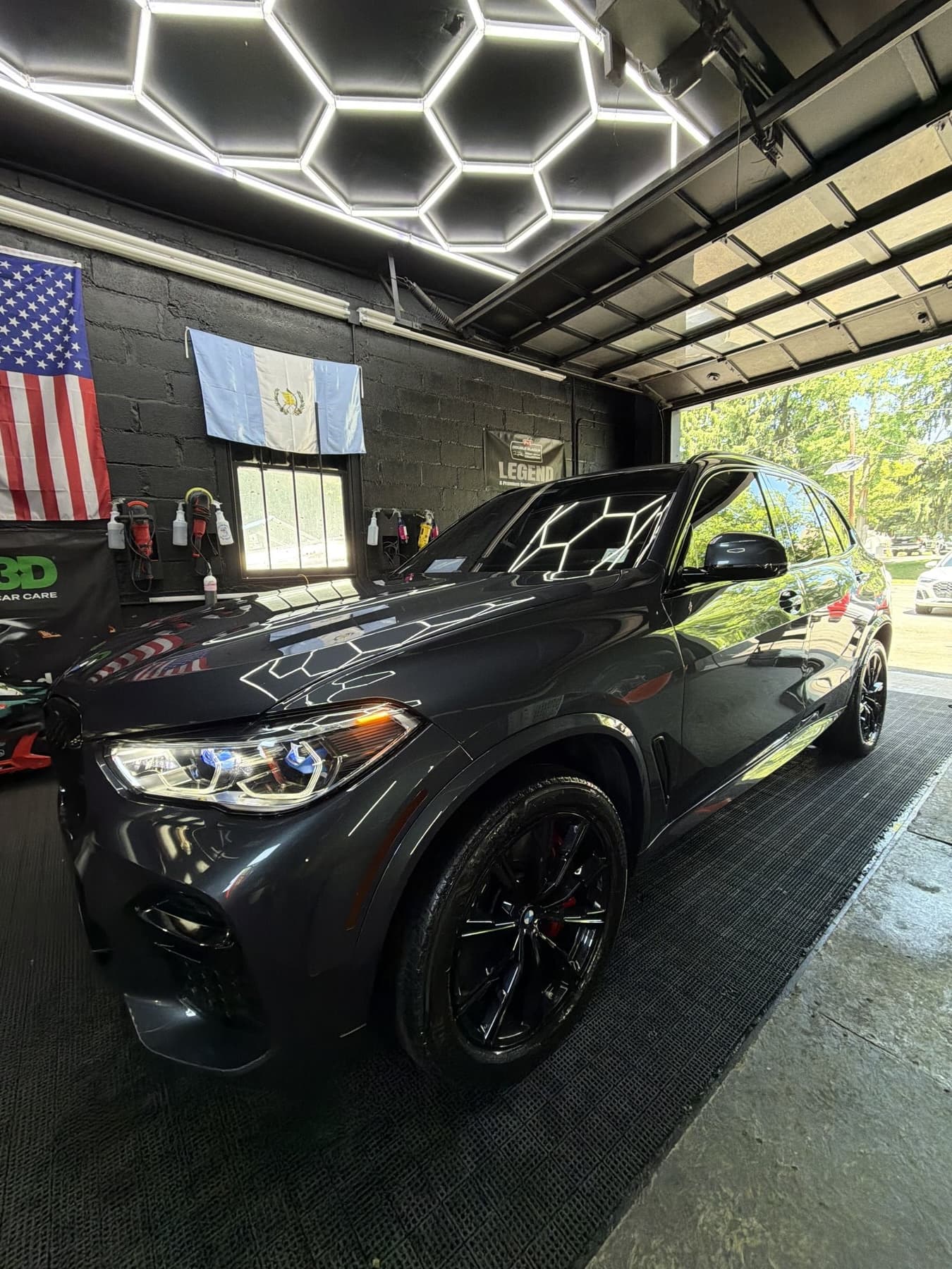 Dark grey BMW X5 after a paint correction and detail