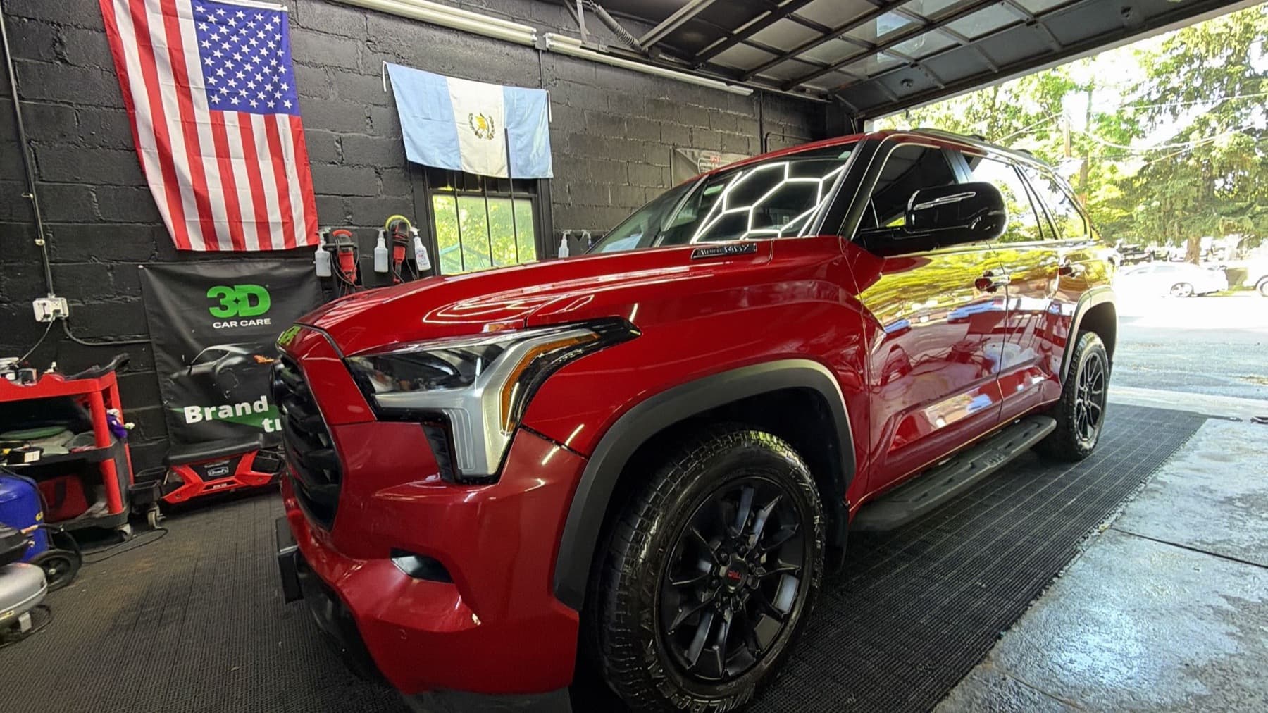 Red Toyota Sequoia after a full wash and decontamination
